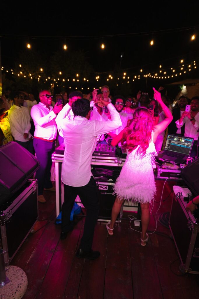 bride and groom dancing in dj booth destination wedding