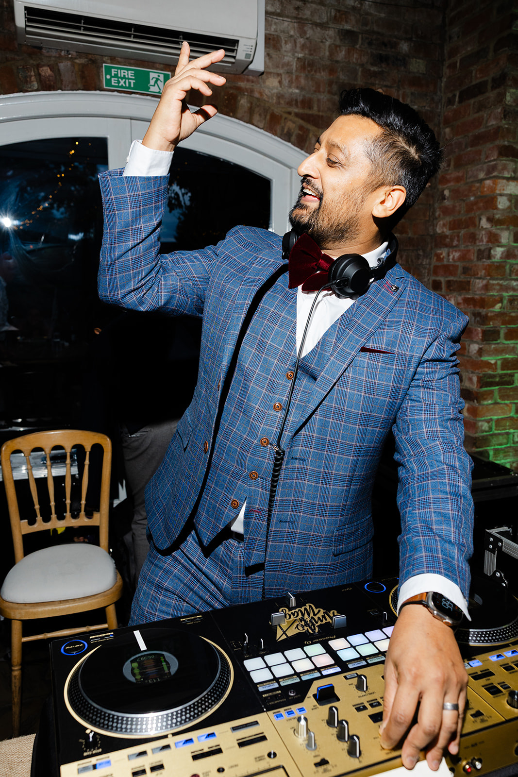 dj ambo magic with hand up djing at an indian wedding at northbrook park in surrey