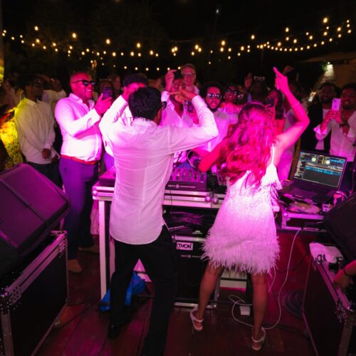 bride and groom dancing in dj booth destination wedding